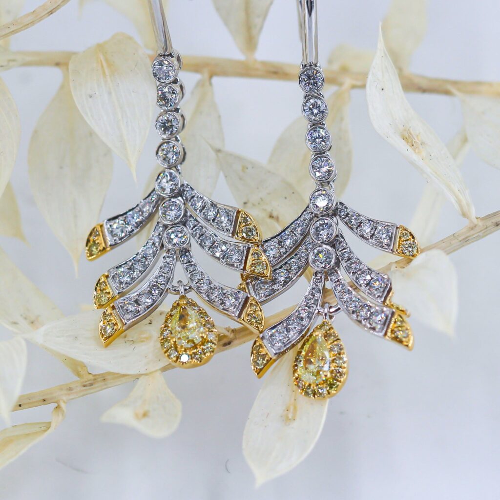 Pear shaped Fancy intense yellow diamond earrings sydney in stock