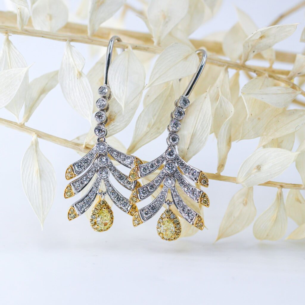 Pear shaped Fancy intense yellow diamond earrings sydney in stock