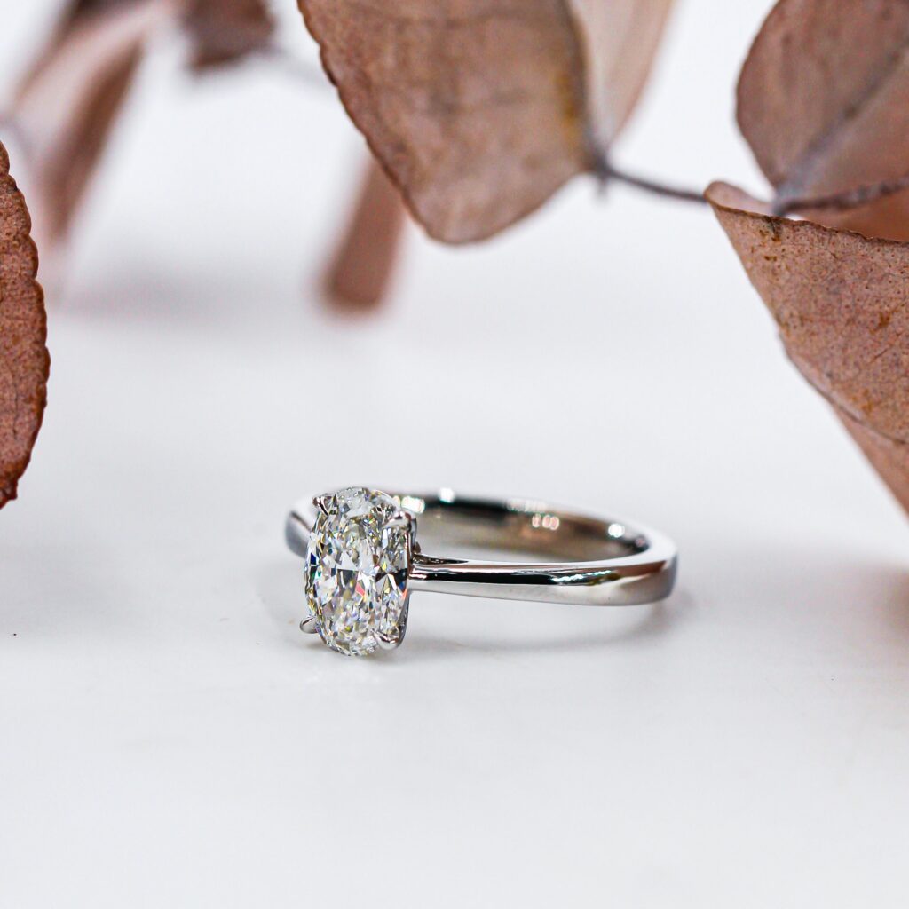 Oval Cut Solitaire Diamond Engagement Ring with Four Claws in Reversed Tapered Shank Style - OVSOR06